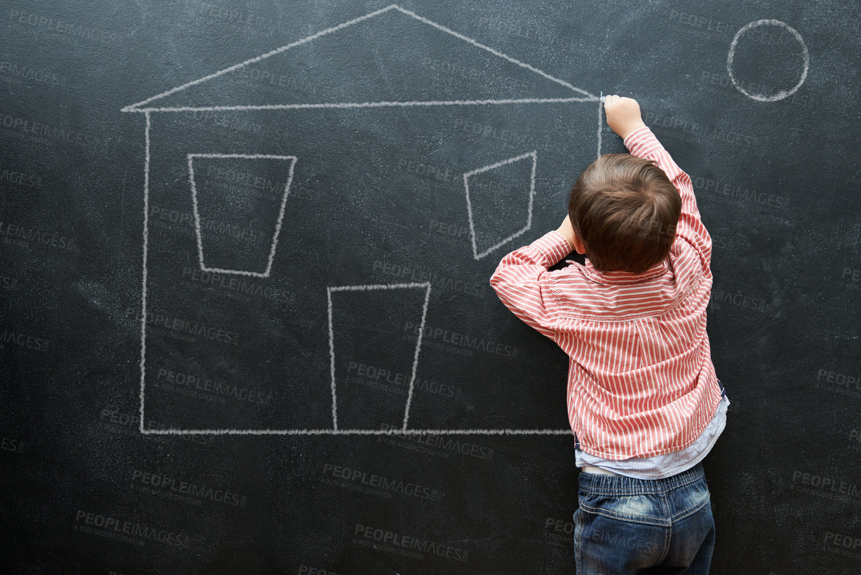 Buy stock photo Kid, drawing and art of house on chalkboard of preschool as young student in classroom. Little boy, creative and imagination for sketch of home on dark background of blackboard for real estate