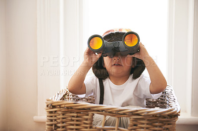 Buy stock photo Child, binocular and hat for game of creativity, adventure or expedition in toy basket at home. Fun, curious and confident kid for spy, pirate or explorer searching for magical, treasure or island