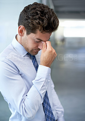 Buy stock photo Tired, frustrated and business man with stress, burnout or anxiety for financial crisis in office. Headache, depression and serious professional with bankruptcy, taxes or fail challenge with mistake