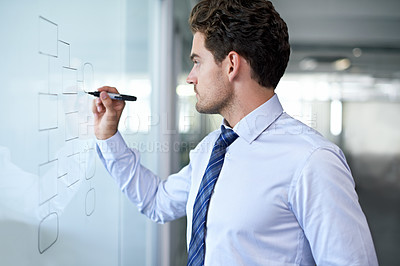 Buy stock photo Cropped view of a young businessman making a mindmap graph on a glass wall 