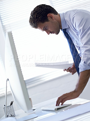 Buy stock photo Businessman, computer and paperwork or typing for online report for research project, review or investment. Male person, legal document and financial planning in America for loan, accounting or web