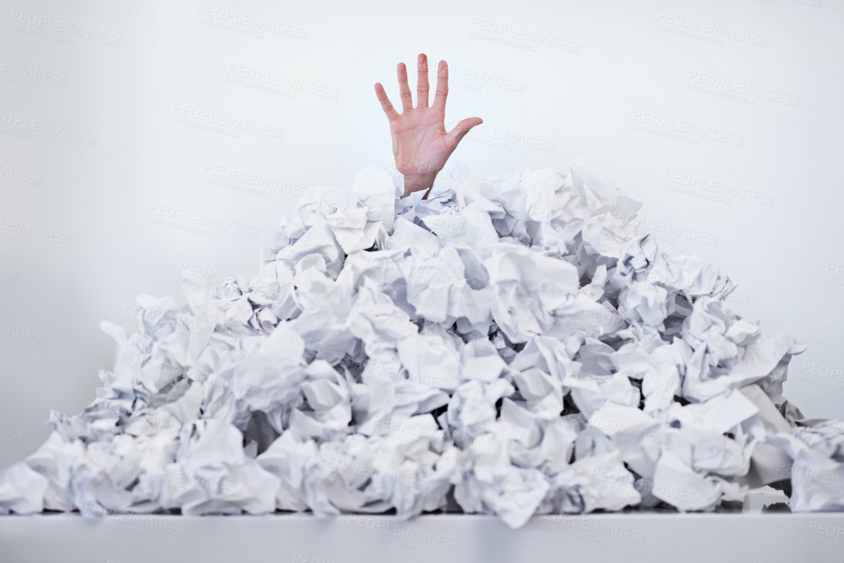 Buy stock photo Person, hand and paper pile or trapped in deadlines for work responsibilities for overwhelmed, exhausted or problem. Fingers, buried and employee reaching for help or business, burnout or documents
