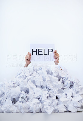 Buy stock photo Person, desk and hands with pile of paperwork, sign and help with burnout, stress and administration. Debt, bills and worker lost in documents, overworked and overwhelmed with pressure in office.
