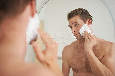 Buy stock photo Mirror, skincare and man with shaving cream application in a bathroom for morning, routine or hygiene. Hair removal, foam and male person in a house with facial product for beauty, wellness or care