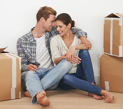 Buy stock photo Shot of a young couple moving into a new home together