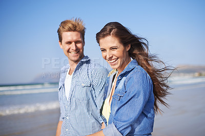 Buy stock photo Couple, laugh and walk on beach for romantic date on sunny afternoon with blue sky in Australia. Big smile, man and woman in love for sweet relationship, fun dating and bonding together in summer