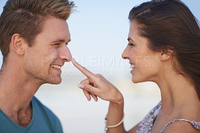 Buy stock photo Couple, laugh and touch nose on playful date, romantic getaway or summer vacation in South Africa. Smile, boyfriend and girlfriend in love for sweet relationship, joyful outing and bonding together