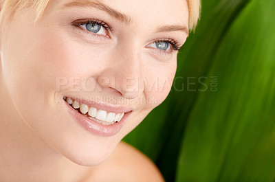 Buy stock photo Face, natural beauty and happy woman with leaf isolated on a green background for skincare, wellness or health. Thinking, cosmetics and model in nature for facial, organic and closeup of dermatology