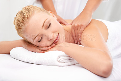 Buy stock photo A beautiful young woman enjoying a massage at a spa