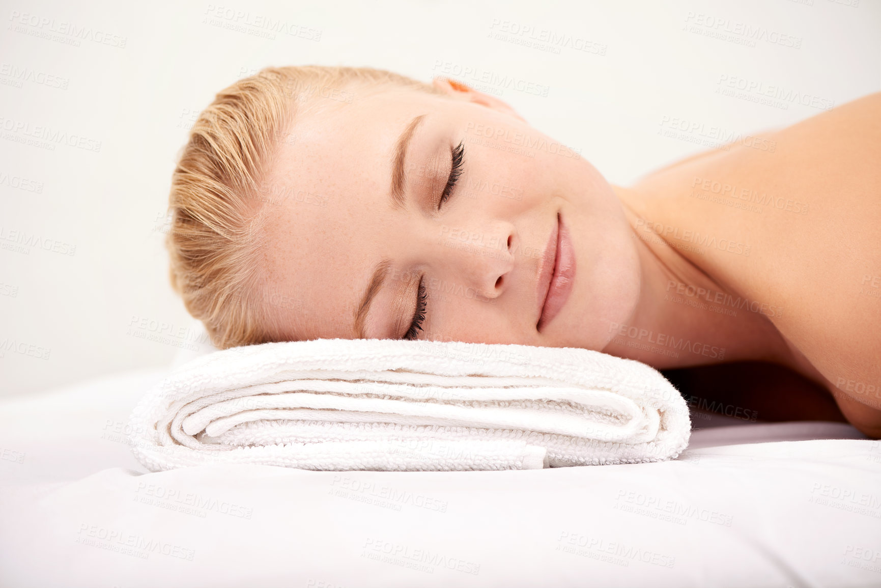 Buy stock photo Relax, sleep and woman at spa with towel for luxury holistic treatment, facial health and professional massage therapy. Self care, peace and refresh for girl on bed with body wellness, rest and hotel