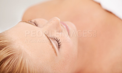 Buy stock photo Relax, rest and face of woman at spa for luxury holistic treatment, facial health and professional massage therapy. Self care, peace and smile, happy girl on bed for body wellness and sleep at hotel.