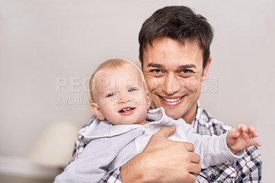 Buy stock photo Portrait, man and smile to hug baby, boy or girl with affection, care and love for bonding at home. Male person, parent or father with young child or toddler for infant, embrace and happiness