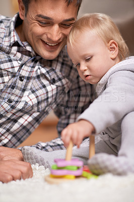 Buy stock photo Happy father, baby and playing with toys in house with love, pride and learning shapes or color in living room. Dad, daughter and educational game for creativity and development of fine motor skills