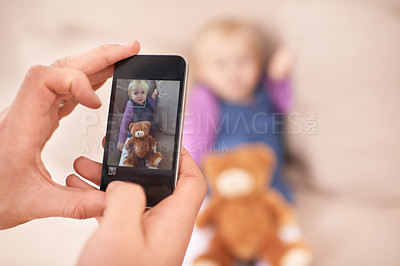 Buy stock photo Cropped shot of a father taking a cellphone picture of his daughter
