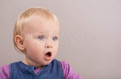 Buy stock photo Children, wow and baby in studio with surprise, announcement or open mouth on grey background. Kids, mockup and girl face shocked by learning promo, news or child development, information or space