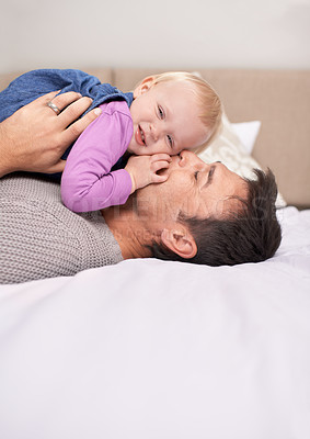 Buy stock photo Father, daughter and bedroom with playful, joy and fun for bonding or family and growth. Man, child and bed for baby, development and happiness with laughing and childhood for parenting and future