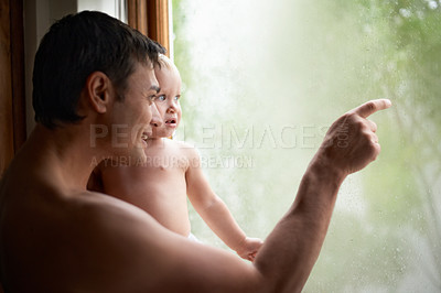 Buy stock photo Rain, window or father and baby in house with glass, writing or art while bonding, playing or learning. Water, window or dad with kid at home for storm, watching or child development and drawing