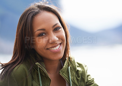 Buy stock photo Happy woman, portrait and travel with jacket in nature for holiday weekend or outdoor vacation. Face of young female person with smile in relax or satisfaction for adventure or journey on mockup