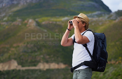 Buy stock photo Man, hiker and binoculars with backpack for sightseeing, outdoor travel or hiking on mountain in nature.Young person, traveler or tourist with bag or optical instrument for view, vision or scope