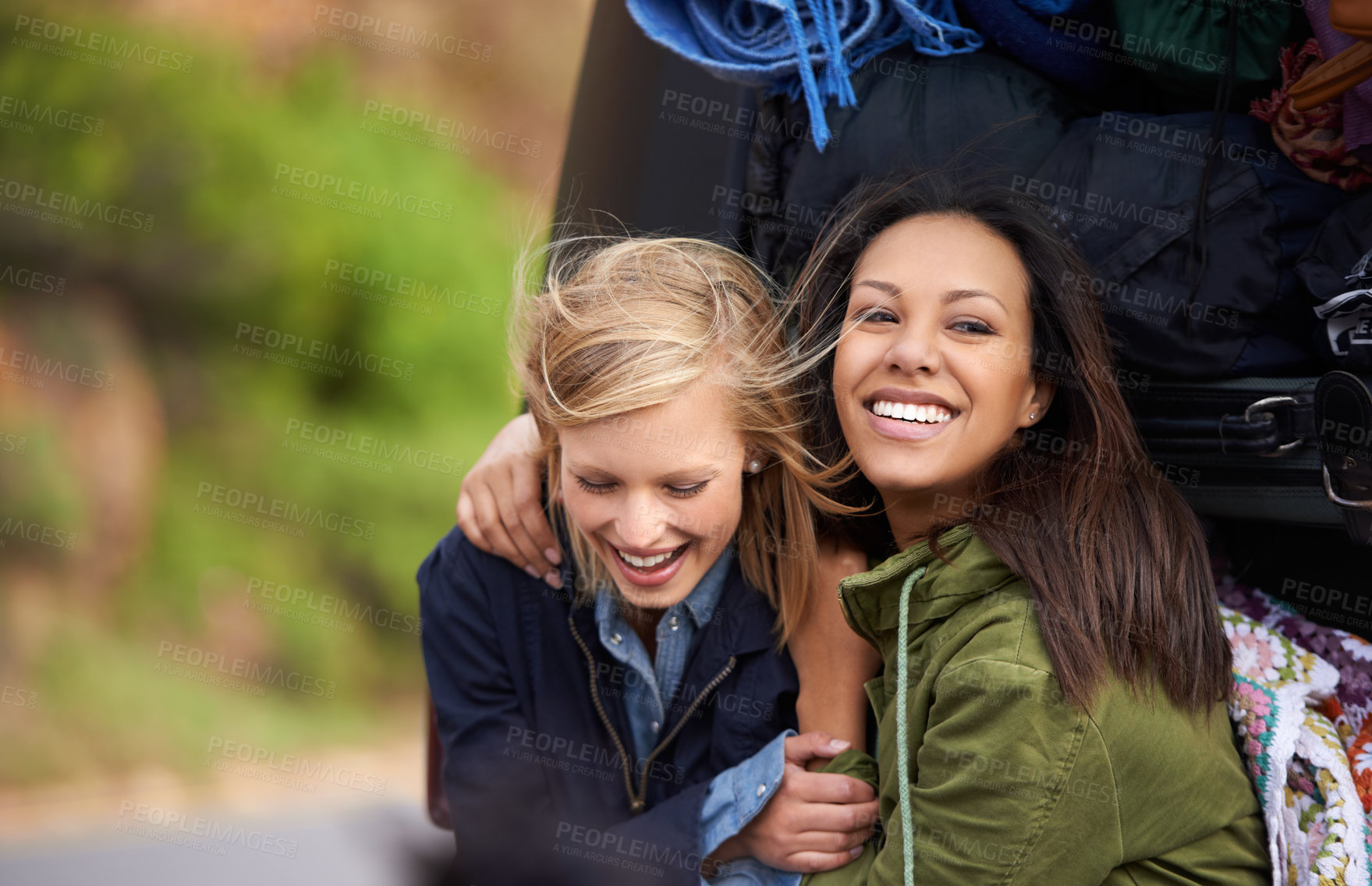 Buy stock photo Happy woman, friends and hug with a car full of luggage for road trip, holiday weekend or outdoor vacation. Female person with smile for friendship, support or care together on adventure or journey