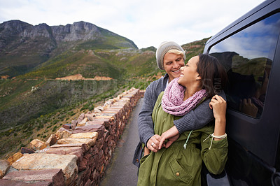 Buy stock photo Happy couple, hug and road trip with love for holiday, weekend or bonding together by car in nature. Young man and woman with smile enjoying romance in support, trust for outdoor vacation by vehicle