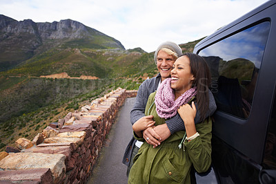 Buy stock photo Happy couple, hug and road trip with love for bonding, holiday or weekend together by car in nature. Young man and woman with smile enjoying romance in support, trust for outdoor vacation by vehicle