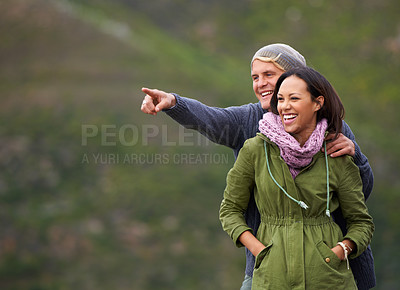 Buy stock photo Happy couple, pointing and nature in adventure for sightseeing, journey or outdoor view together. Man and woman with smile enjoying holiday, vacation or getaway in natural environment on mockup 