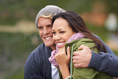 Buy stock photo Happy couple, hug and relax in nature for love, support or outdoor holiday, weekend or vacation. Face of young man and woman with smile in embrace for fun bonding, care or adventure together outside 