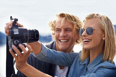 Buy stock photo Happy couple, camera and selfie in photography for travel, memory or outdoor moment together in nature. Face of young man and woman with smile for photo, picture or capture on adventure or journey