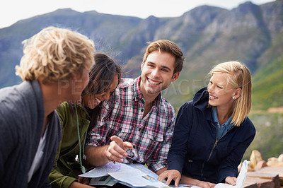 Buy stock photo Happy people, friends and map in nature for travel, location or discussion on destination. Young group with smile, document or paper of outdoor routes, paths or planning road trip or next stop