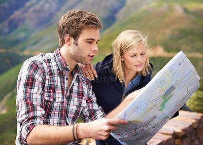 Buy stock photo Couple, paper map and travel, search location for navigation and road trip, adventure and tourism in Australia. People are lost, reading destination document for direction and journey in mountains