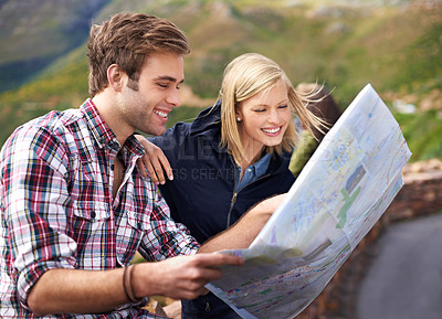 Buy stock photo Happy couple, map and travel with location, destination or coordinates on mountain in nature. Young man and woman with smile, document or paper with routes for navigation, help or outdoor tourism