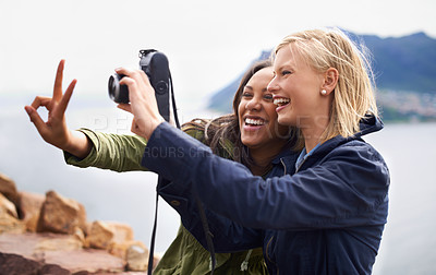 Buy stock photo Happy woman, friends and laughing with peace sign or camera for funny photography or moments together in nature. Female person with smile for photo, picture or memories of emoji on outdoor holiday