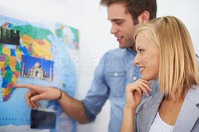 Buy stock photo Travel agency collaboration, world map and happy business people, agent or partner point at global tour location. Partnership, collaboration and planning team working on route journey destination