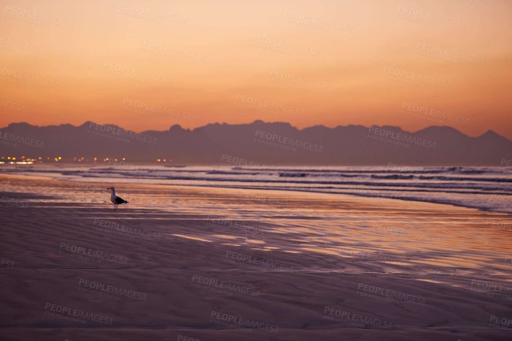 Buy stock photo Sunset, ocean and beach for landscape with nature, orange sky and mountain for travel and tourism. Water, Earth and adventure with natural background, waves and environment with scenic view of island
