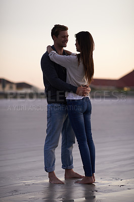 Buy stock photo Romance, embrace and couple on beach at sunset for tropical holiday adventure, love and bonding together. Commitment, happy man and woman on romantic date with ocean, evening sky and hug on vacation.