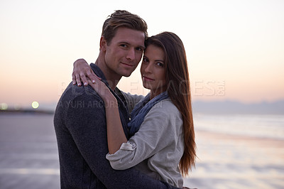 Buy stock photo Love, hug and portrait of couple on beach at sunset for tropical holiday adventure, relax and bonding together. Evening, happy man and woman on romantic date with ocean, sky and embrace on vacation.