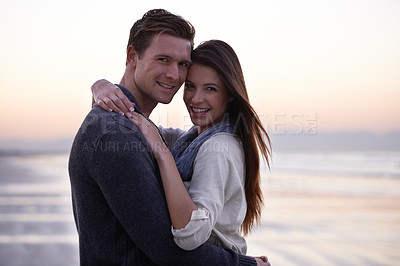 Buy stock photo Love, hug and portrait of happy couple on beach at sunset for tropical holiday adventure, relax and bonding together. Evening, man and woman on romantic date with ocean, sky and embrace on vacation.