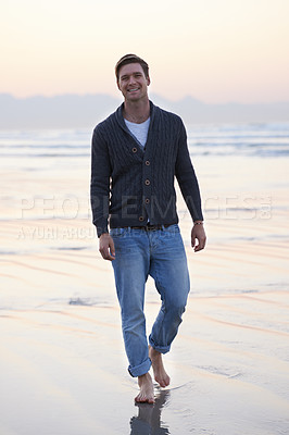 Buy stock photo Man, walking and happy in portrait by ocean, sunset and vacation with nature to relax at beach. Person, travel and outdoor by sea with feet in sand for holiday, adventure or smile by sea in Australia