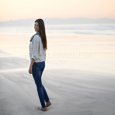 Buy stock photo Woman, walking and happy in portrait by ocean, sunset and vacation with nature to relax at beach. Girl, person and outdoor by sea with feet in sand for holiday, adventure or smile by sea in Australia