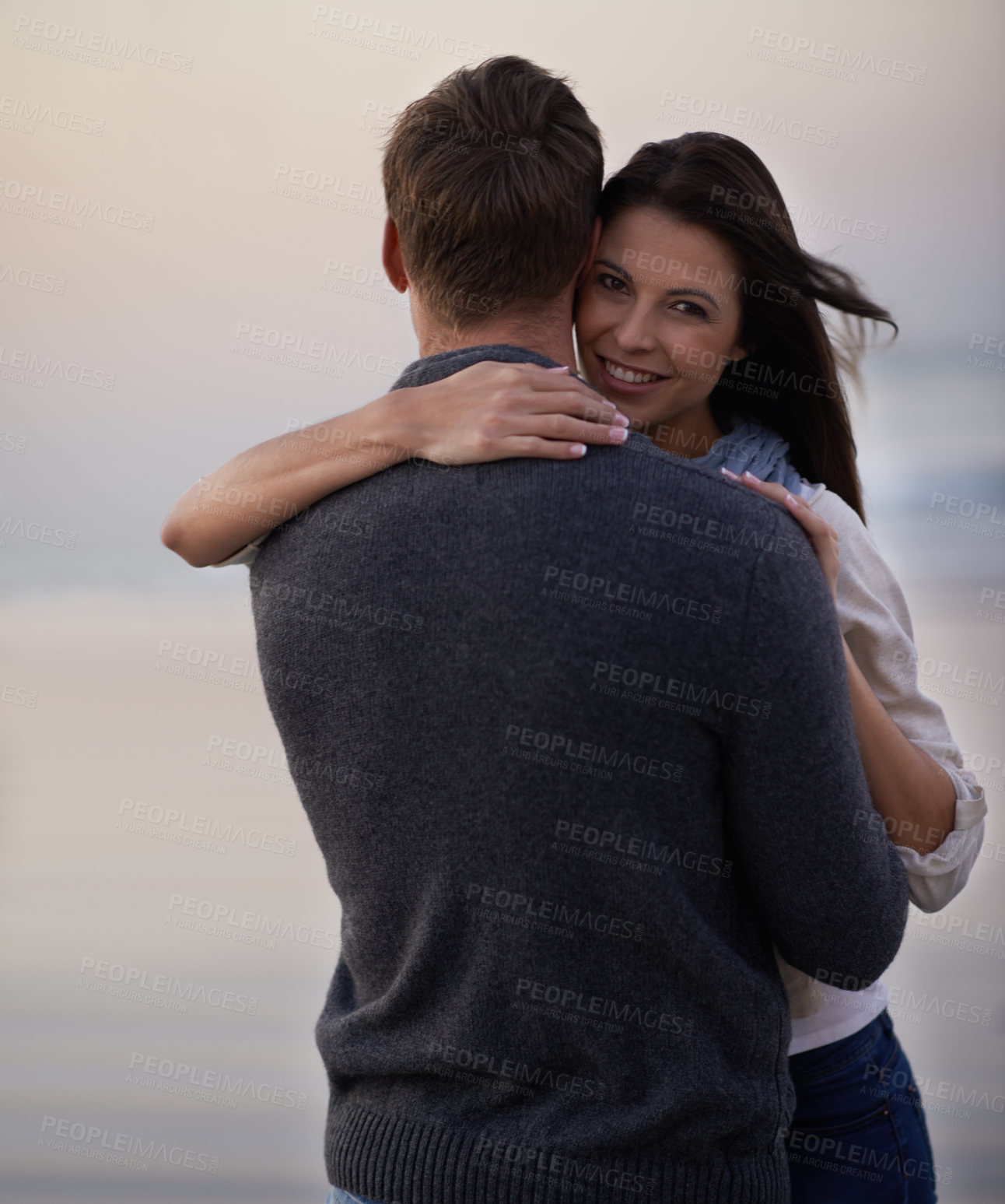 Buy stock photo Love, smile and portrait of couple at ocean for tropical holiday adventure, hug and bonding together. Relax, happy man and woman on romantic sunset date with beach, evening and embrace on vacation
