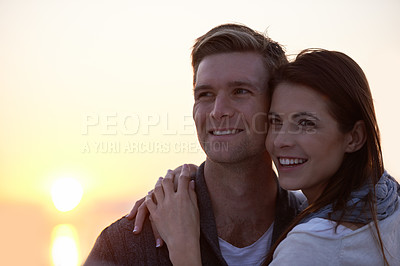 Buy stock photo Love, hug and couple at ocean with sunset sky for tropical holiday adventure, relax and bonding together. Commitment, happy man and woman on romantic date with ocean, evening and embrace on vacation.