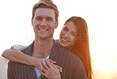 Buy stock photo Love, hug and portrait of couple at sunset for tropical holiday adventure, relax and bonding together. Evening, happy man and woman on outdoor date with romance, sky and embrace on vacation in nature