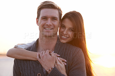 Buy stock photo Love, embrace and portrait of couple in sunset for tropical holiday adventure, relax and bonding together. Evening, happy man and woman on outdoor date with romance, sky and hug on vacation in nature