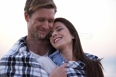 Buy stock photo Couple, love and happy embrace at sunset with blanket together on holiday in Florida. Travel, vacation and man hug woman outdoor on date in summer with care, support and kindness in marriage