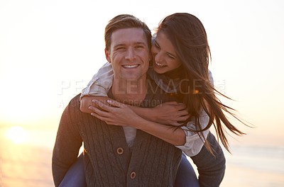 Buy stock photo Portrait, piggy back and couple at ocean at sunset for tropical holiday adventure, relax and bonding outdoor. Love, happy man and woman on romantic date with beach, evening sky and vacation together