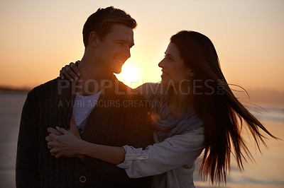 Buy stock photo Couple hug, sunset on beach and travel for bonding, romance outdoor with love and trust. Happiness, support and loyalty with people in relationship, sunshine and adventure together with smile