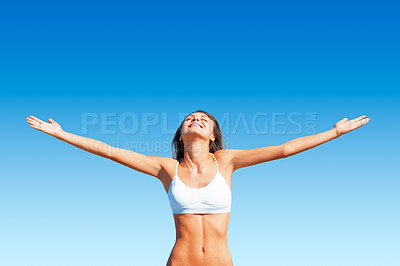 Buy stock photo Freedom, woman and sunshine outdoor with happiness and calm feeling with open arms. Blue sky, mindfulness and female person with happy smile and healthy body from sun and celebrate life with wellness