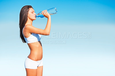 Buy stock photo Fitness, woman and drinking water for hydration after workout, exercise or training on mockup space or blue sky. Thirsty, active and fit female person with drink bottle for healthy, body or wellness