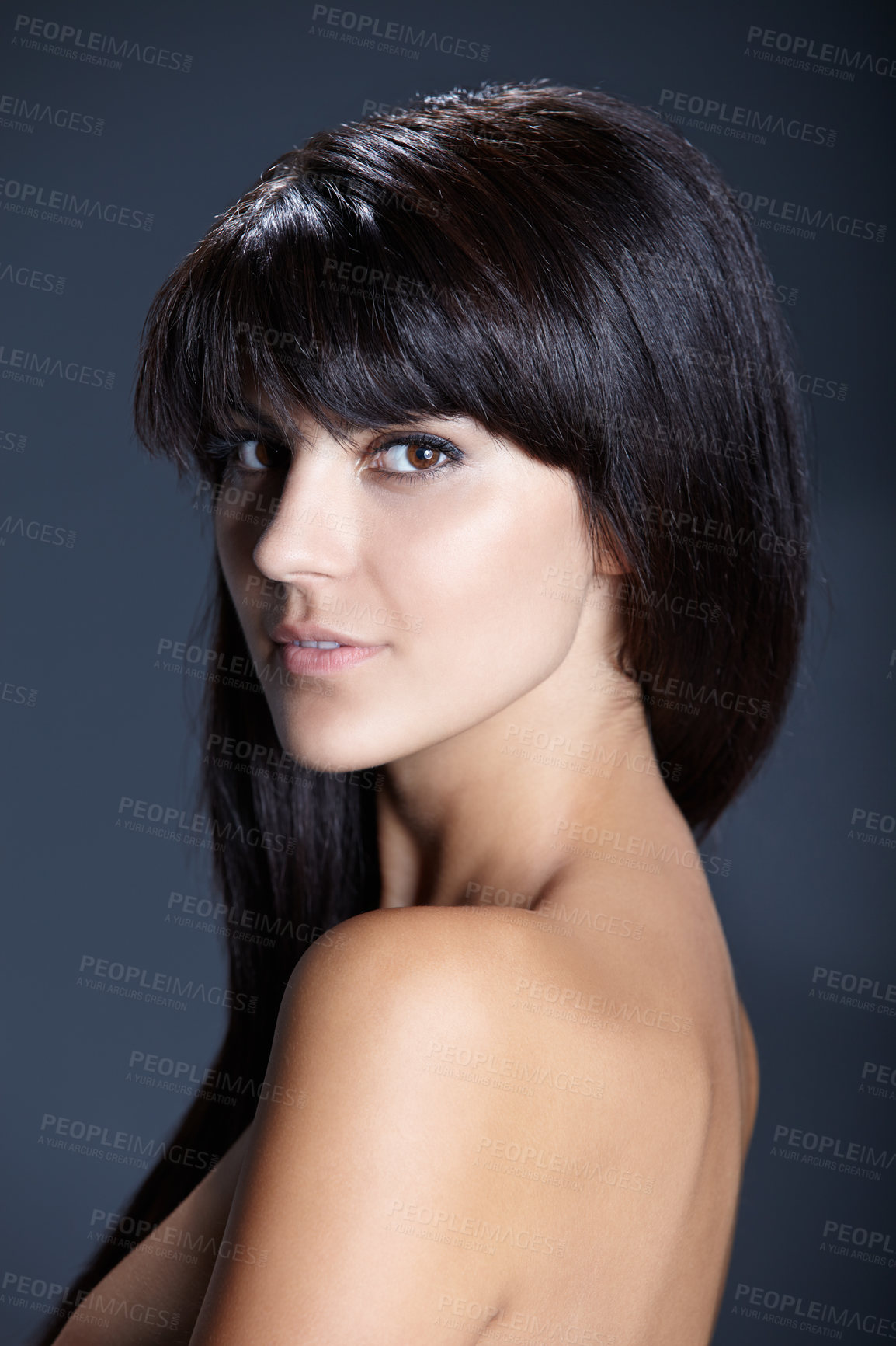 Buy stock photo Beauty, skincare and portrait of woman with confident skin glow, natural makeup and facial care in studio. Pride, dermatology and luxury cosmetics with face of girl isolated on dark blue background.